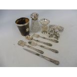 A horn beaker with silver rim, and silver shield shaped plaque, a set of four silver plated peppers,