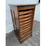 An early 20th Century tambour fronted cabinet, with pull out slides and panelled sides, 22" w x