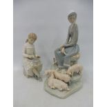 A Lladro porcelain group of a lady surrounded by piglets, 10 1/2" h plus a smaller Nao porcelain