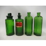 Four green glass poison pharmacy bottles, one with glass label for arsenic.
