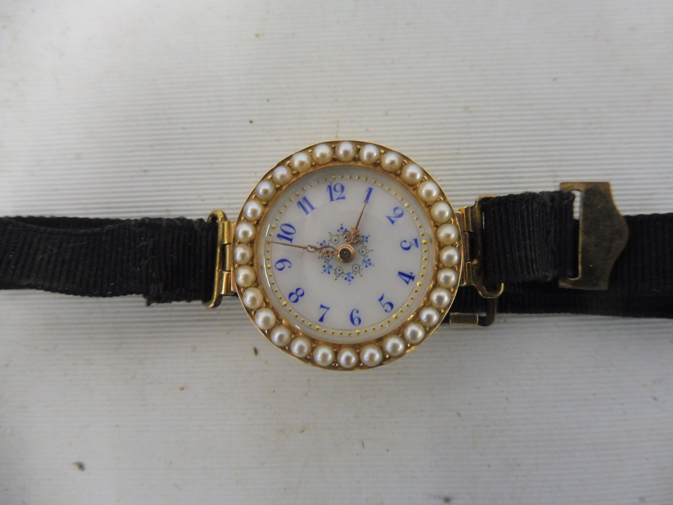 A high quality yellow metal, probably at least 15ct gold ladies wristwatch, the circular white