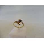 A cased 14ct gold sapphire and diamond ring, size L/M, 1.6g.