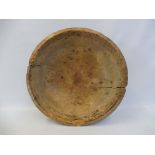 A large early 19th Century Welsh turned sycamore dairy bowl with old repairs, 17" diameter.