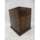 A small table top mahogany chest of four drawers of good colour, 9" w x 11 1/2" h x 10" d.