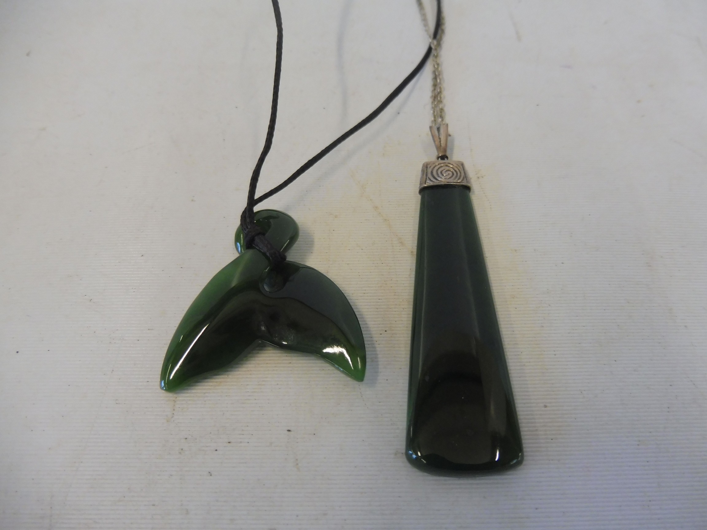 A New Zealand jade pendant and one other. - Image 2 of 3