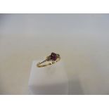 A 9ct gold diamond and ruby ring, size K/L, 1.3g.