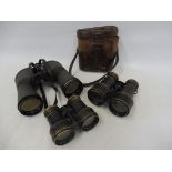 A pair of Hans Weiss de luxe 16 x 50 wide angle field glasses, and two further pairs, one in a tan