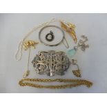 A silver two piece belt buckle, a silver slender bangle, and various other items of jewellery.