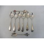 A set of six silver teaspoons from HMS Thane (aircraft carrier) plus two others with enamel ends.