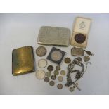 A small silver vesta case, a silver heart shaped locket, a silver 1890 crown, various other coins