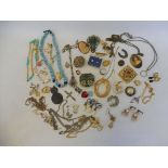 A quantity of assorted jewellery, including brooches, necklaces etc.