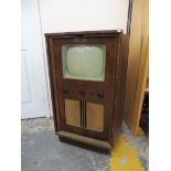 A walnut cased fllor standing Bush television.