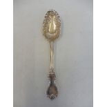 A Victorian silver serving spoon, of ornate form, London 1841, maker's mark rubbed.