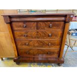 A large early Victorian well figured mahogany chest of two short over three long drawers with an