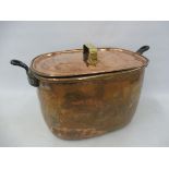 A large Victorian copper cooking pot and cover, 22" overall length.