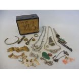 A small box of assorted costume jewellery.