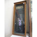 An oak framed wall mounted front opening display cabinet/notice board, lacking internal divisions,