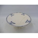 A Continental pottery blue and white tazza of unusual Art Deco design, impressed and printed marks