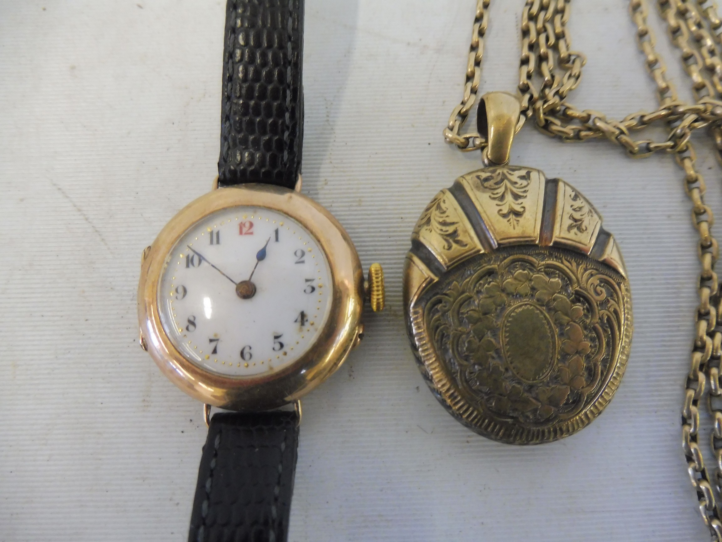 A 9ct gold ladies wristwatch, weight with movement approx. 16.6g, plus a yellow metal oval locket,