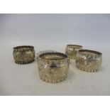 A set of four good quality silver plated napkin rings plus a silver cigarette case, Birmingham 1928.