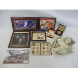 A selection of bank notes, coins in presentation cases etc.
