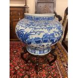 A very large Chinese blue and white squat bulbous vase on a hardwood stand, overall height with
