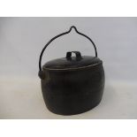 A Kenrick & Sons of West Bromwich three gallon cast iron cooking pot.