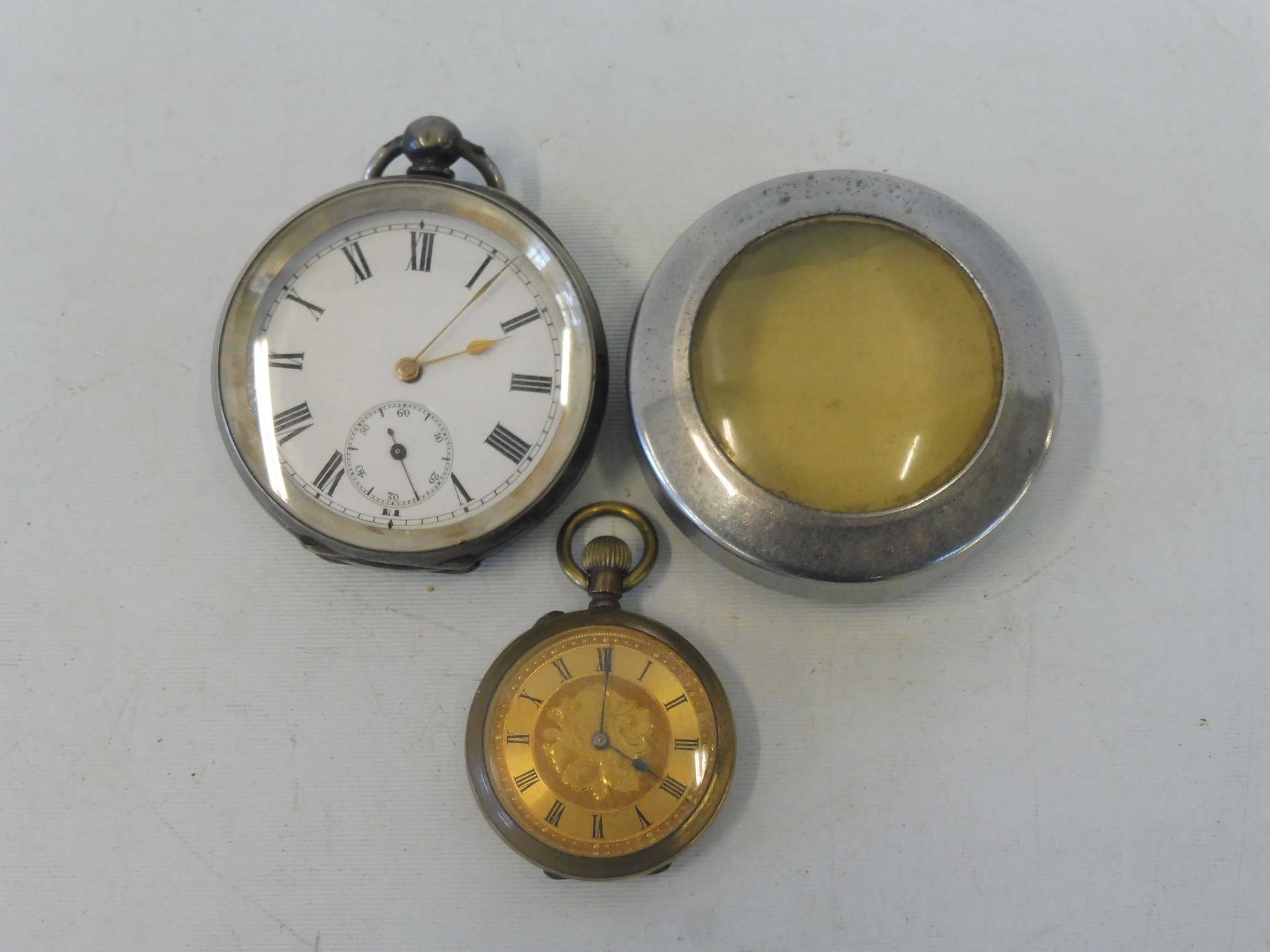 A silver pocket watch and one other.