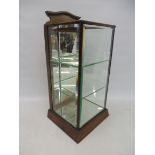 A late 19th Century miniature showcase with bevelled glass, fitted with shelves, 11 1/2" w x 23 1/2"