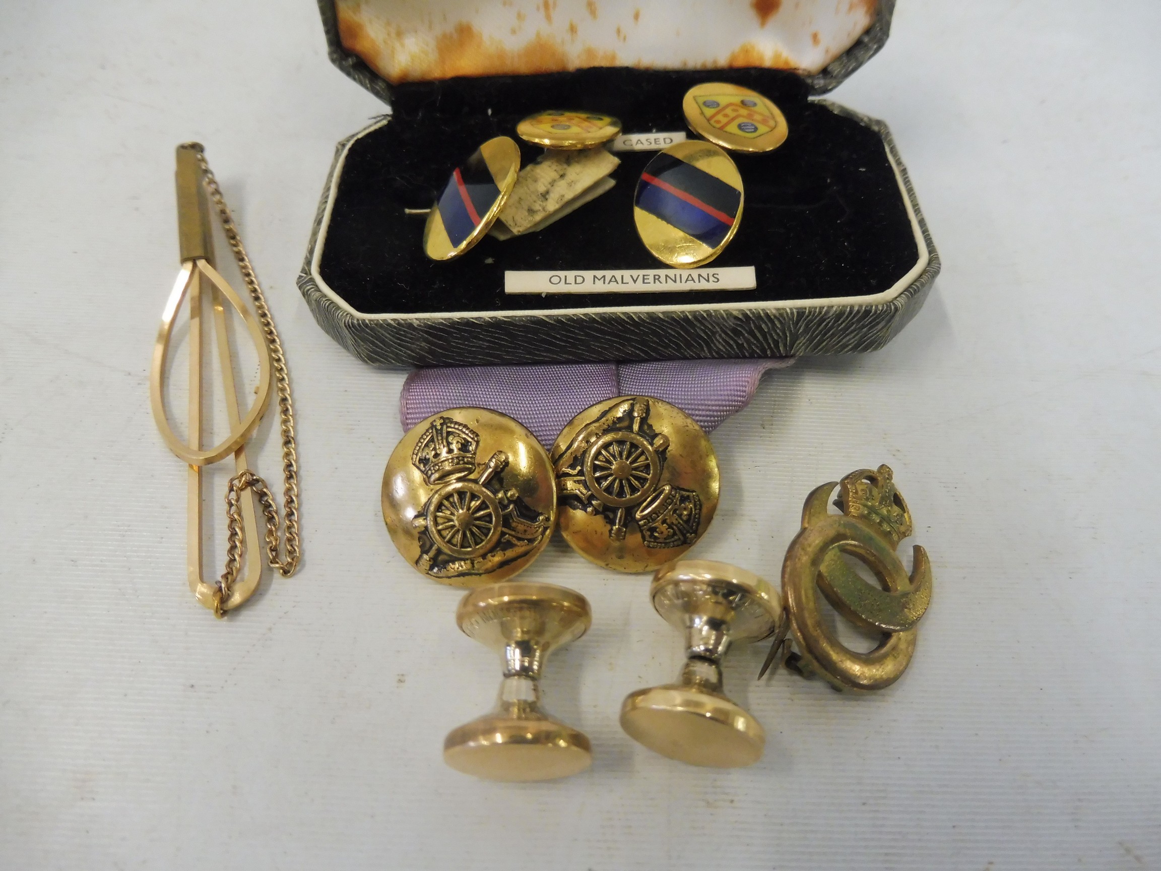 A cased pair of Old Malvernians part enamel cufflinks, another pair of yellow metal cufflinks and