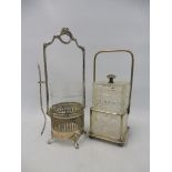A WMF silver plated stand with glass liner and hanging pickle fork, plus a cut glass square lidded