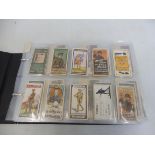 An album of Wills cigarette cards including recruiting posters, British Engines, Speed, Oxford &