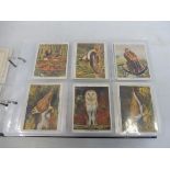 An album of Players large and small cigarette cards including Types of Horses, Golf, Film Stars,