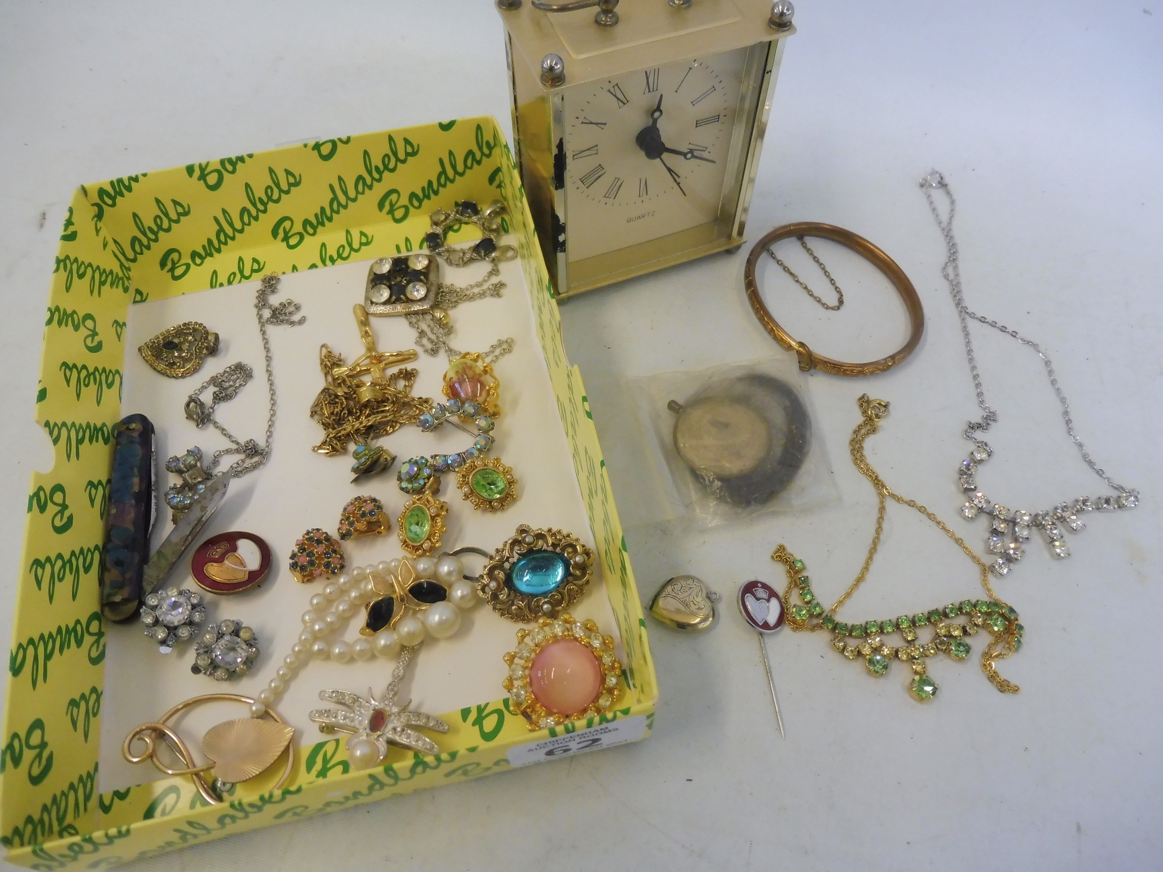 A collection of assorted costume jewellery including a silver stick pin etc.