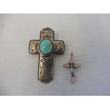 A heavy silver cross inset with a large oval turquoise coloured stone, 14.4g, plus a small white