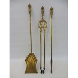 A set of three brass fire implements.