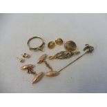 A selection of 9ct gold including a horseshoe stick pin, a pair of cufflinks, studs etc. 12.4g.