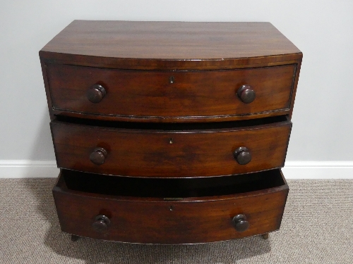 A Victorian mahogany bow front Chest of Drawers, with three long drawers, bracket feet and wooden - Image 2 of 3