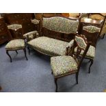 An Edwardian walnut five-piece upholstered Parlour suite, each with carved and shaped crest, pierced