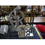 Three modern Soapstone Sculptures, all depicting two forms intertwined, of varying sizes, 6½in (