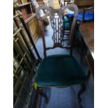 A set of four Victorian rosewood Dining Chairs, the pierced splats with foliate moulding, cabriole