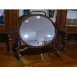 A Victorian mahogany Spider Mirror, the oval swing mirror frame with inlaid rim, 19½in (49.5cm)