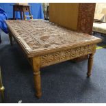 A mid-20th century Tanzanian carved hardwood Coffee Table, the rectangular top above two frieze