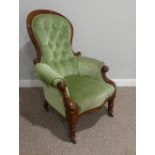 A Victorian walnut gentleman's Armchair, with spoon shaped button back, scrolled arms leading to
