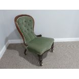 A Victorian walnut button back Nursing Chair, with spoon shaped back, turned front supports on