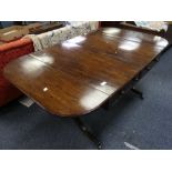 A 19th century mahogany Sofa Table, the rectangular twin-flap top with moulded edge and rounded