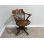 An early 20thC American oak Desk Chair, with cast iron screw adjustment mechanism, with later