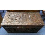 An Oriental camphorwood Chest, with carved decoration of an Eastern port scene, 37in (94cm) wide x