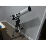 An SCS Astro floor standing telescope, with tripod.