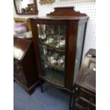 An Edwardian inlaid mahogany Display Cabinet, with astragal glazed convex door, two panes broken,